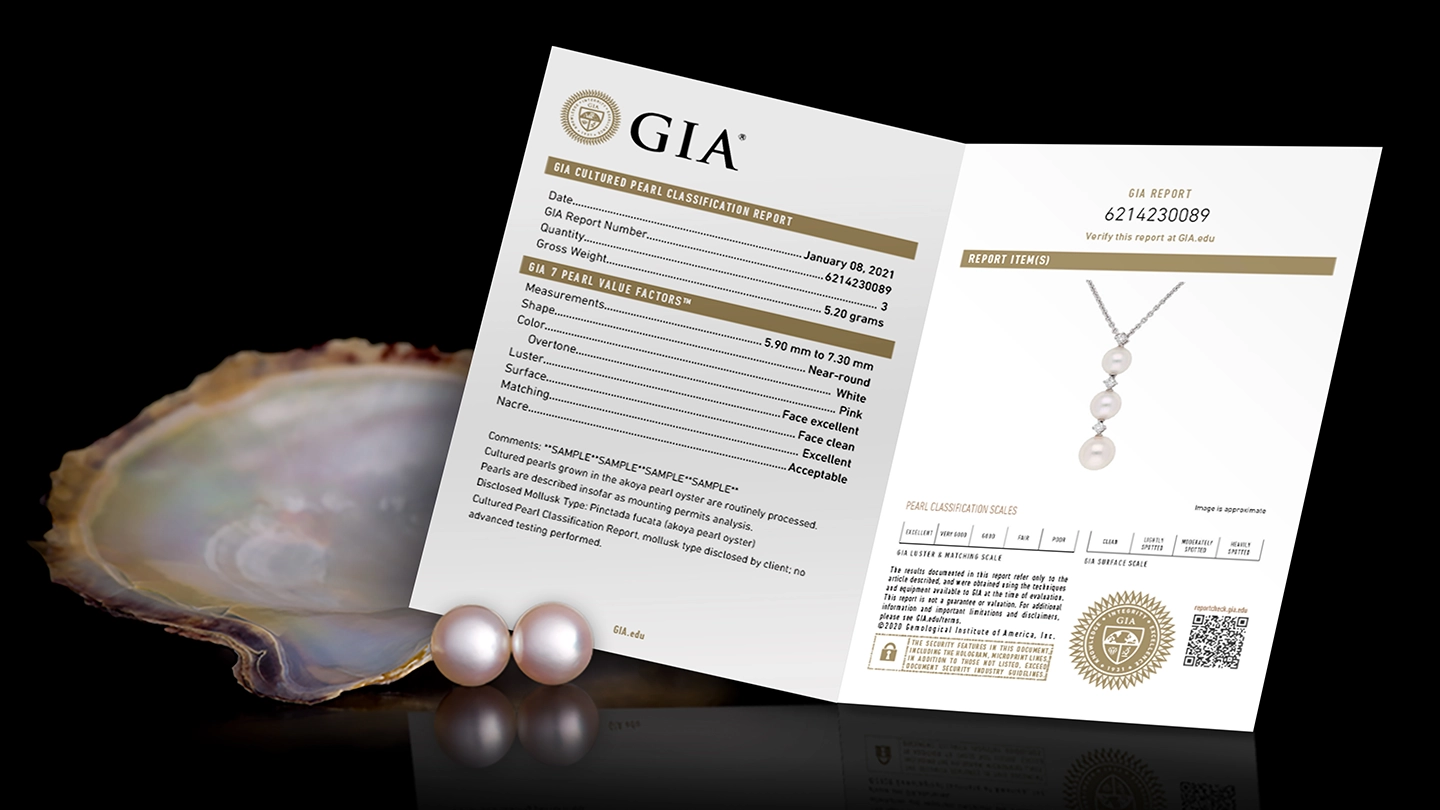 GIA pearl report displayed with pearl earrings and an open oyster shell.
