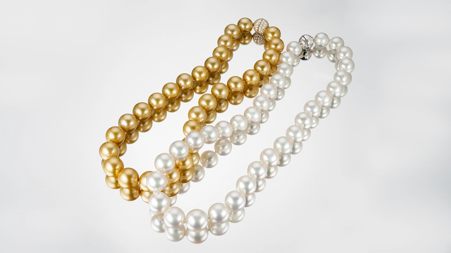 Two South Sea pearl strands, one white and one golden