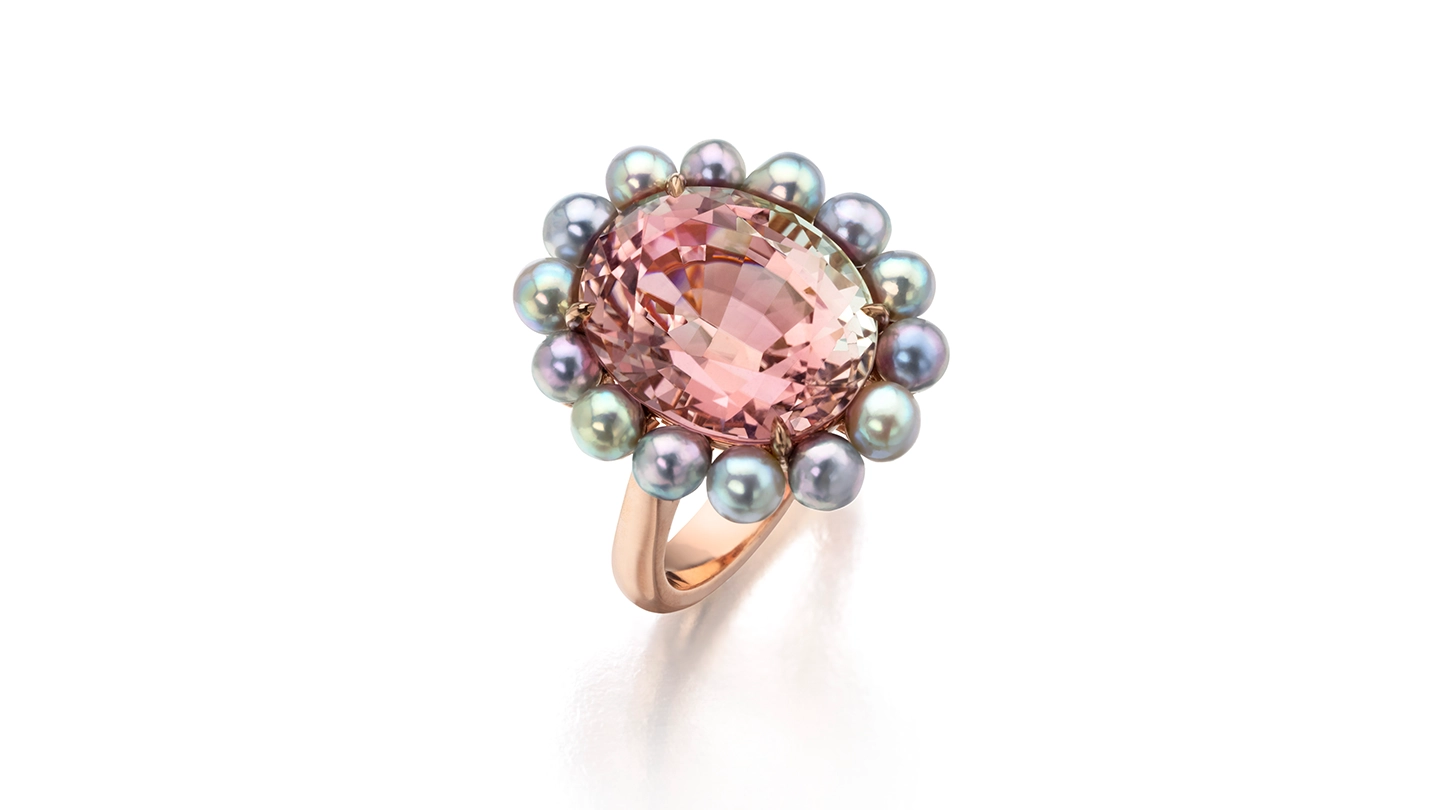 Bicolor tourmaline ring with a halo of blue akoya pearls