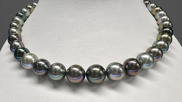 Figure 3. Necklace featuring multicolored Tahitian bead cultured pearls measuring approximately 9 to 12 mm, in a combination of various colors and overtones. Photo by Artitaya Homkrajae; courtesy of Eliko Pearl Company. Figure 3. Necklace featuring multicolored Tahitian bead cultured pearls measuring approximately 9 to 12 mm, in a combination of various colors and overtones. Photo by Artitaya Homkrajae; courtesy of Eliko Pearl Company.