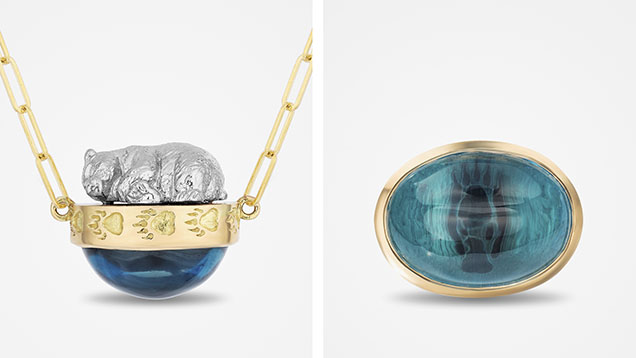 Figure 2. A platinum and 18K yellow gold polar bear necklace (left), set with an oval blue topaz cabochon showcasing a reproduction of the endangered animal’s footprint (right), part of the “Fading Footprints” collection. Courtesy of Samira Mazloom. Figure 2. A platinum and 18K yellow gold polar bear necklace (left), set with an oval blue topaz cabochon showcasing a reproduction of the endangered animal’s footprint (right), part of the “Fading Footprints” collection. Courtesy of Samira Mazloom.