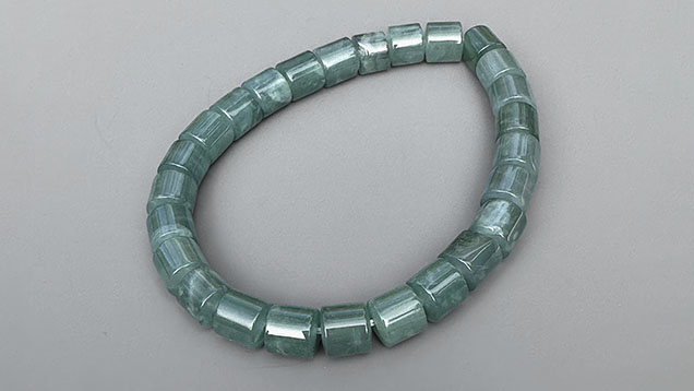 Figure 7. Guatemalan blue jadeite jade bracelet with 6 mm diameter cylindrical beads. Photo by Jennifer Stone-Sundberg; courtesy of Jade West Corp.