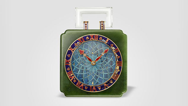 Figure 2. Desk clock, Cartier Paris, 1927, featuring gold, nephrite, Kingfisher feathers (dial), rose-cut diamonds, and red and blue enamel. Courtesy of the Cartier collection.