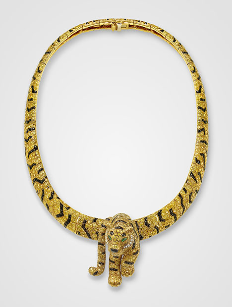 Figure 6. Tiger necklace and detachable brooch, Cartier Paris, 1986. Intensely colored yellow diamonds, marquise-shaped emeralds (eyes), and onyx (stripes) set in gold, showing Cartier’s patented “fur setting” developed in the 1980s. Courtesy of the Cartier collection.