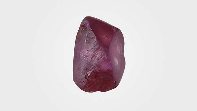 Figure 1. This 3.93 ct diamond rough was color treated to introduce its vibrant purple color. Photo by Nick “Ka Chun” Chan. Figure 1. This 3.93 ct diamond rough was color treated to introduce its vibrant purple color. Photo by Nick “Ka Chun” Chan.