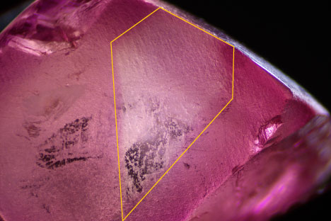 Figure 3. An uneven color distribution is observed under visible light with a distinct boundary resembling a profile view of an elongated diamond (outlined in yellow). Photomicrograph by Nick “Ka Chun” Chan; field of view 7.50 mm. Figure 3. An uneven color distribution is observed under visible light with a distinct boundary resembling a profile view of an elongated diamond (outlined in yellow). Photomicrograph by Nick “Ka Chun” Chan; field of view 7.50 mm.