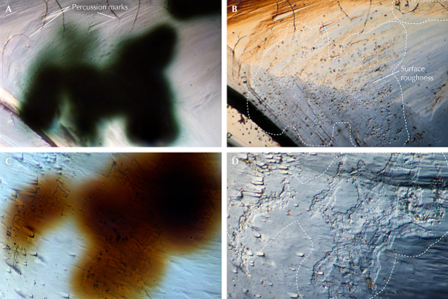 Figure 7. Samples Guy572 (A and B, field of view 0.288 mm) and Guy515 (C and D, field of view 0.144 mm) display surface textures coincident with green (A) and brown (C) radiation staining. The surface roughness in B contains rounded pits. Percussion marks labeled in A are abrasion and transport features typically associated with placer diamonds such as these. Reflected light images were taken using white-balanced DIC settings to increase shadow contrast. Photomicrographs by Taryn Linzmeyer.