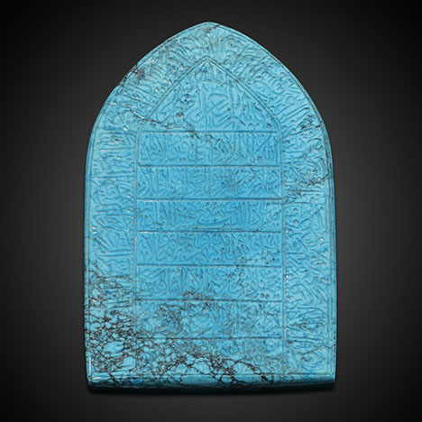 Figure 25. At more than 94,000 pieces, polished turquoise was the most plentiful item in Gregorio di Girach-Mirman’s inventory. Most of this material likely came from the Iranian deposit of Neyshabur, a valuable source of turquoise for more than 5,000 years. The modern Persian turquoise tablet shown here is intricately engraved with an Arabic prayer. Photo by Robert Weldon; courtesy of Shaikha Haya bint Ali Al-Khalifa and Shaikha Marwa bint Abdulrahman Al-Khalifa.