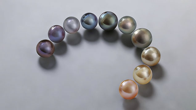 Figure 1. These 10 representative pearls from the 53 studied, selected for Raman analysis, range in color from deep purple to orange-red. Photos by Chuting Zhang.