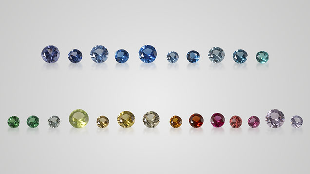 Figure 1. Glass-ceramics can be created in a full spectrum of colors to imitate a wide range of natural gemstones. Shown here are transparent samples (0.10–0.37 ct) donated for this study by the Formica Group, from left to right: GC-01 to GC-10 (top row) and GC-11 to GC-24 (bottom row). Photo by Nuttapol Kitdee. Figure 1. Glass-ceramics can be created in a full spectrum of colors to imitate a wide range of natural gemstones. Shown here are transparent samples (0.10–0.37 ct) donated for this study by the Formica Group, from left to right: GC-01 to GC-10 (top row) and GC-11 to GC-24 (bottom row). Photo by Nuttapol Kitdee.