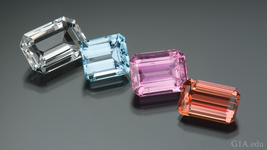 Colorless topaz from Nigeria, light blue topaz from Brazil, purplish-pink topaz from Pakistan, and orange-red topaz from Brazil exhibit the multiple colors of the November birthstone. Colorless topaz from Nigeria, light blue topaz from Brazil, purplish-pink topaz from Pakistan, and orange-red topaz from Brazil exhibit the multiple colors of the November birthstone.