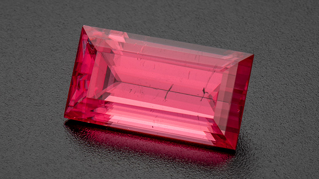 A 7.94 ct rectangular step-cut rhodochrosite from the Sweet Home mine in Colorado’s Alma Mining District. Photo by Robert Weldon; courtesy of Barker & Co. A 7.94 ct rectangular step-cut rhodochrosite from the Sweet Home mine in Colorado’s Alma Mining District. Photo by Robert Weldon; courtesy of Barker & Co.
