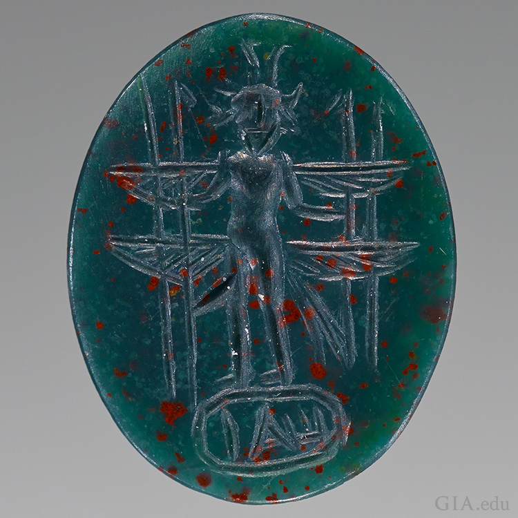An engraved bullae bloodstone cameo from the Roman Empire features the March birthstone. An engraved bullae bloodstone cameo from the Roman Empire features the March birthstone.