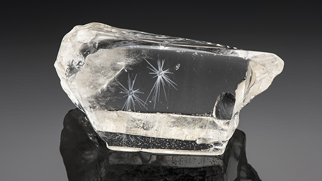 3D internal laser engraving created these two white stellate inclusions in quartz.