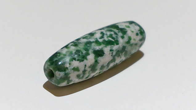 Barrel-shaped bead with unusual texture and color. Barrel-shaped bead with unusual texture and color.
