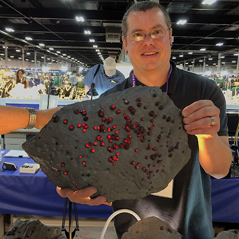 Jason Baskin with almandine in graphite schist. Jason Baskin with almandine in graphite schist.