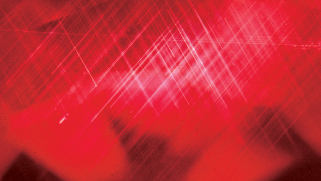 Silk. Intersecting needles of the mineral rutile create a common ruby inclusion called silk. When they are intact, they prove the ruby was not heat-treated at very high temperatures. It’s still possible that lower-temperature heat treatment might have occurred. Photo: John I. Koivula, GIA.