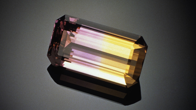 Like most faceted ametrine, this bicolor rectangular step cut has no eye-visible inclusions. Photo by Van Rossen, © ICA, courtesy Columbia Gem House. Like most faceted ametrine, this bicolor rectangular step cut has no eye-visible inclusions. Photo by Van Rossen, © ICA, courtesy Columbia Gem House.