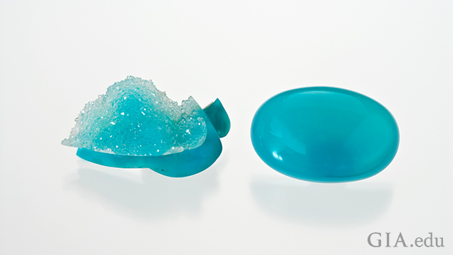 Drusy quartz sits on top of Chrysocolla, right, and a polished oval cabaochon of Chrysocolla. Drusy quartz sits on top of Chrysocolla, right, and a polished oval cabaochon of Chrysocolla.