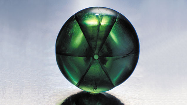 Trapiche Emerald. This 10.03-carat stone is a trapiche emerald. Its inclusions form rays in a star-like pattern. This well-executed cabochon cut shows off this unusual arrangement. Courtesy Colombian Emeralds Co.