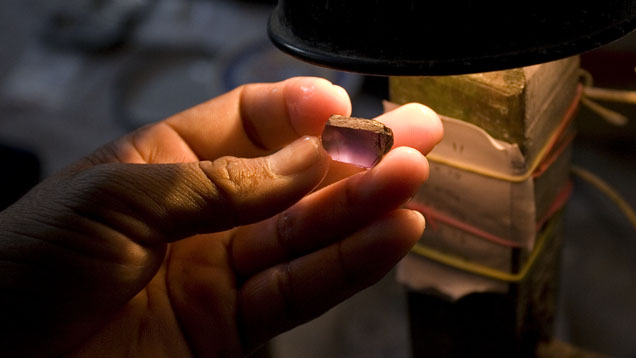 Once faceted, this stone will show a mostly purplish color. The preform stage is where the decision is made between higher weight yield and finer color. Once faceted, this stone will show a mostly purplish color. The preform stage is where the decision is made between higher weight yield and finer color.