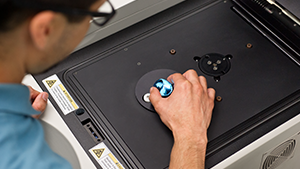 Researcher using a XRF spectrometer. Researcher using a XRF spectrometer.