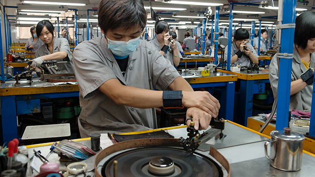 Workers at Chow Tai Fook polish diamonds by hand for greatest precision.