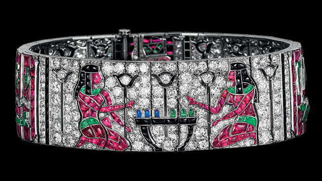 This multi-colored Van Cleef & Arpels bracelet from 1924 is decorated with ancient Egyptian hieroglyphic motifs. It features buff-top emeralds, sapphires, rubies, pavé-set diamonds, and calibrated onyx. Most of the house’s Egyptian revival jewels, which were at the height of fashion in the 1920s, are clips or bracelets created between 1922 and 1925. Photo courtesy of Van Cleef & Arpels. This multi-colored Van Cleef & Arpels bracelet from 1924 is decorated with ancient Egyptian hieroglyphic motifs. It features buff-top emeralds, sapphires, rubies, pavé-set diamonds, and calibrated onyx. Most of the house’s Egyptian revival jewels, which were at the height of fashion in the 1920s, are clips or bracelets created between 1922 and 1925. Photo courtesy of Van Cleef & Arpels.