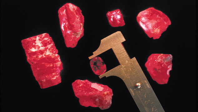 Rubies from Myanmar. These rubies were all mined in Myanmar (formerly known as Burma). The faceted stone weighs 11.55 carats and the rough stones weigh between 16.65 carats and 278.50 carats. Photo: Robert E. Kane/GIA.