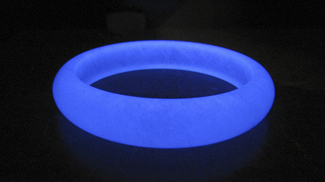 Polymer-impregnated aventurine quartz bangle under UV light Polymer-impregnated aventurine quartz bangle under UV light