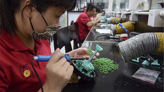 Workers manufacturing wax models in Guangdong province Workers manufacturing wax models in Guangdong province