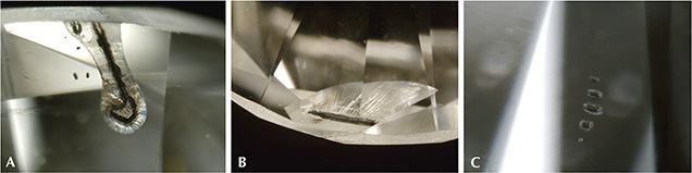 AOTC HPHT synthetic diamond photomicrographs showing inclusions, feathers, or fractures