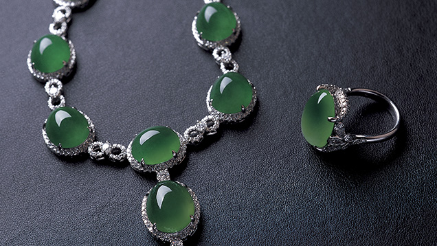 Jadeite cabochons mounted in karat gold with diamond accent stones