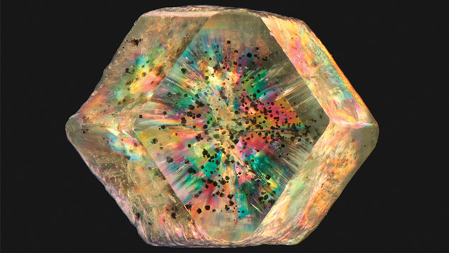 Demantoid viewed through polished window Demantoid viewed through polished window