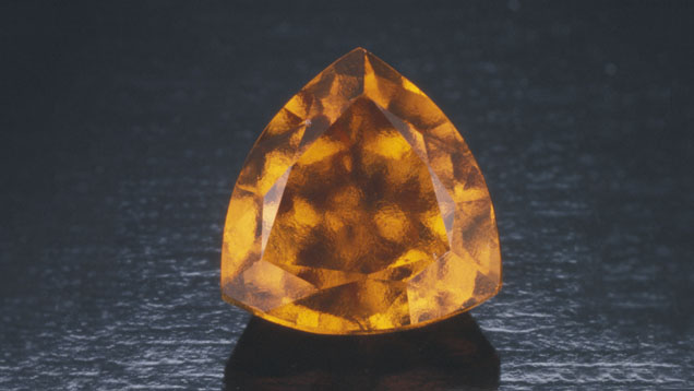 Hessonite Garnet. Hessonite garnet often has a turbulent inner appearance called the roiled affect. - © GIA & Tino Hammid, courtesy Gordon Bleck