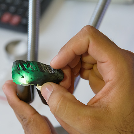 Examining rough emerald Examining rough emerald