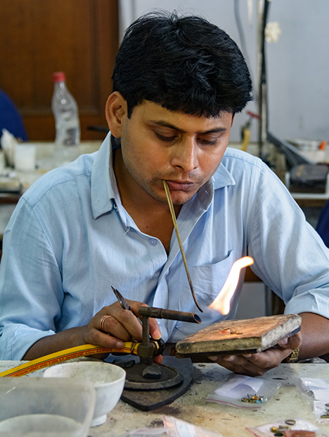 Jeweler with blowpipe Jeweler with blowpipe