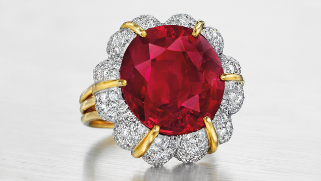 This ring features a 15.99 ct. oval-shaped Burmese ruby surrounded by diamonds and mounted in platinum and 18K gold.