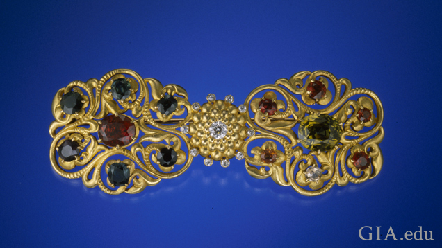 An intricate, golden brooch. An intricate, golden brooch.