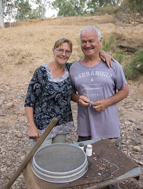 Couple with fossicking tools