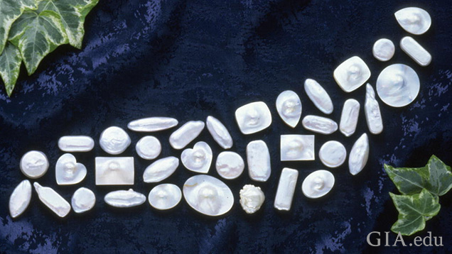 A suite of fancy-shaped cultured pearls and blister pearls
