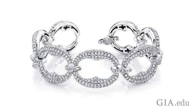 Image of white gold bracelet featuring hundreds of melee.. There are approximately 9.50 ct of melee (791 round diamonds) in this 18K white gold bracelet. If the melee were not carefully matched for color, the bracelet would lose much of its elegant beauty. Courtesy of Uneek