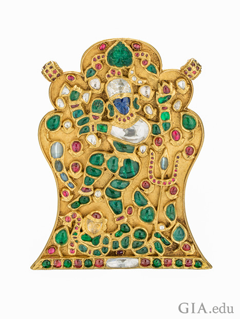 Gold Pendant of India god Shiva showing ruby, emerald, diamond, blue sapphire and cat’s eye chrysoberyl gems. Gold Pendant of India god Shiva showing ruby, emerald, diamond, blue sapphire and cat’s eye chrysoberyl gems.