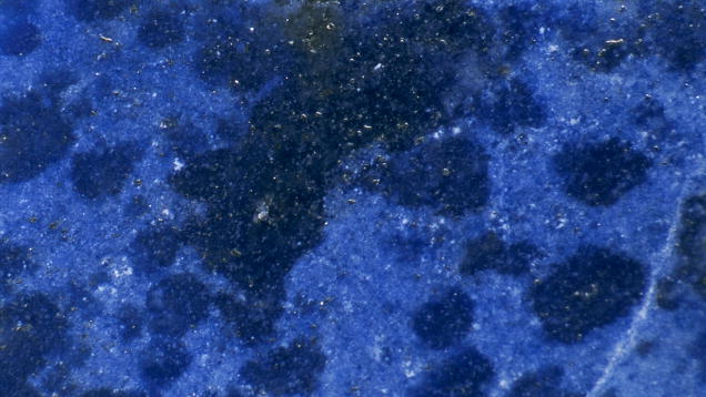 Lapis Lazuli. Lapis lazuli is an aggregate of several minerals. Lazurite grains provide its characteristic color. The higher the percentage of lazurite grains in the aggregate, the darker the blue color. - John Koivula
