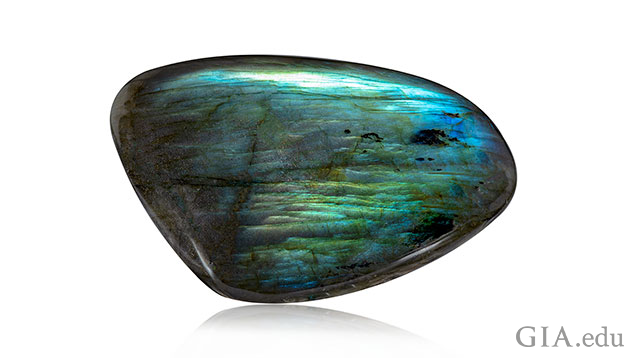 An elongated rectangle shape piece of labradorite. An elongated rectangle shape piece of labradorite.