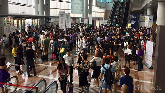 A large group of people in a hallway.