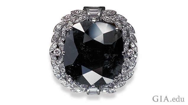 Image of Black Orloff diamond in a white gold setting surrounded by melee diamonds Image of Black Orloff diamond in a white gold setting surrounded by melee diamonds