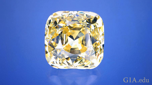 A large square cut yellow diamond. A large square cut yellow diamond.
