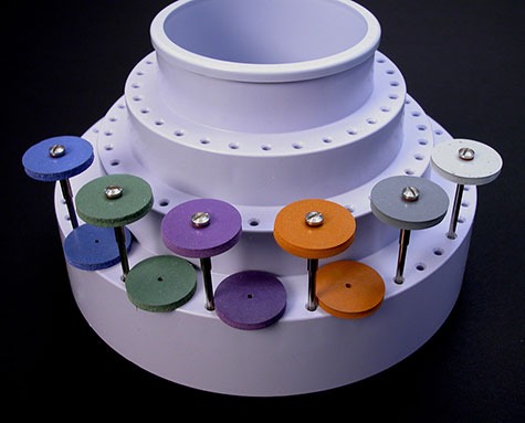 Close-up view of a tool organizer holding a variety of abrasive wheels Close-up view of a tool organizer holding a variety of abrasive wheels