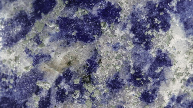 Lapis Lazuli. Calcite shows up as white flecks or streaks in the aggregate.